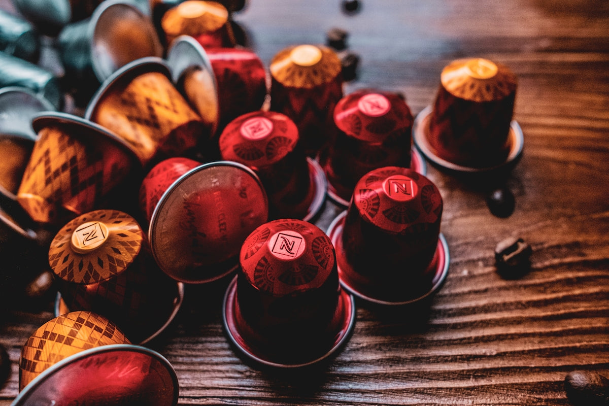 A bunch of red candles sitting on top of a wooden table