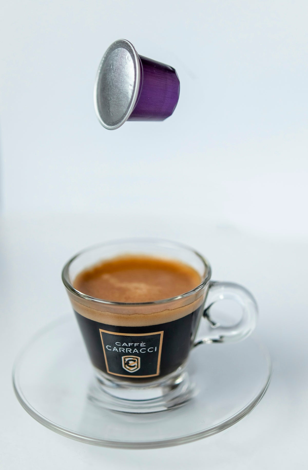 a cup of coffee is being poured into the cup