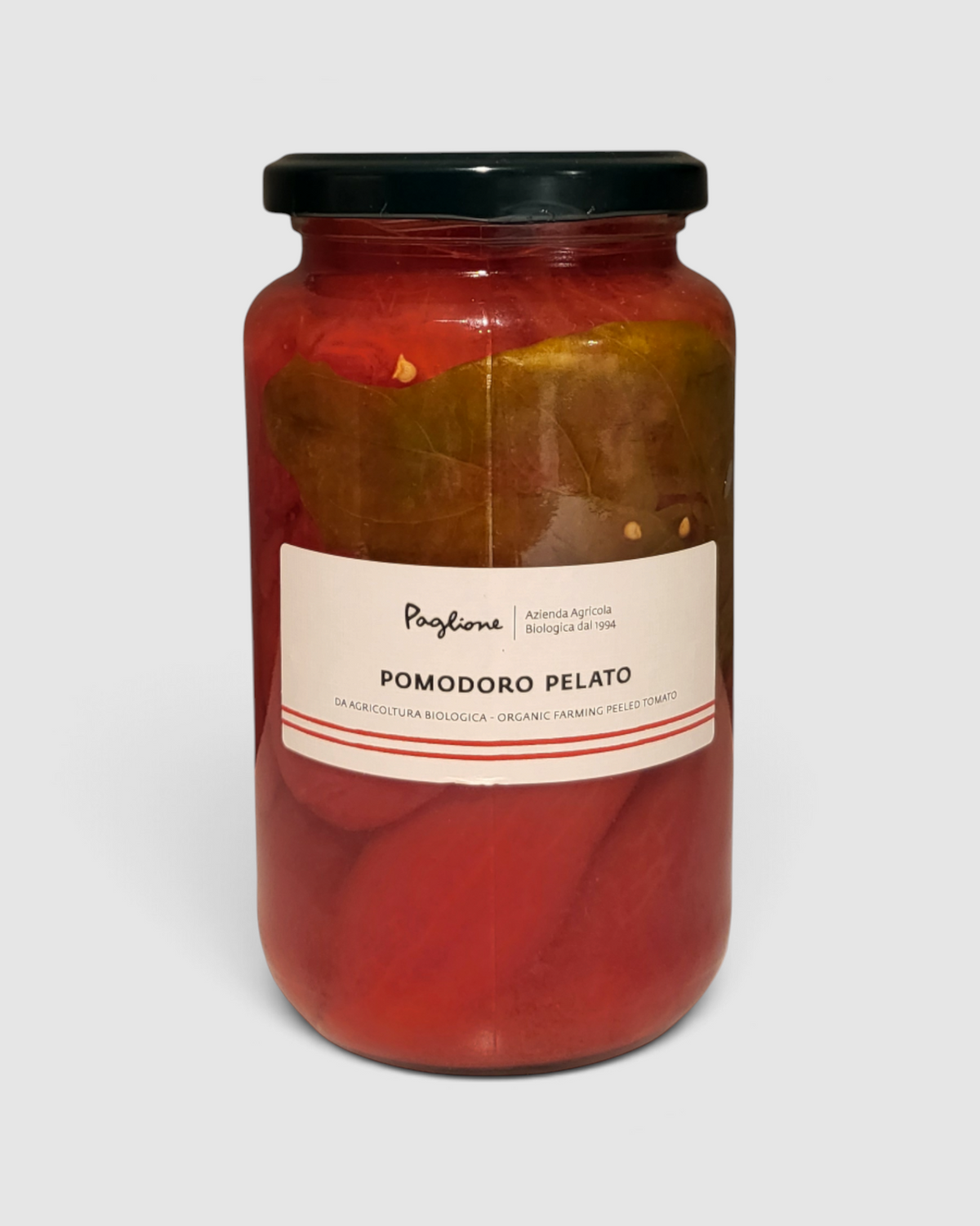 Barattolo di pomodori pelati a mano Raró Shop, prodotto biologico Az. Agricola Paglione da 530g con foglia di basilico