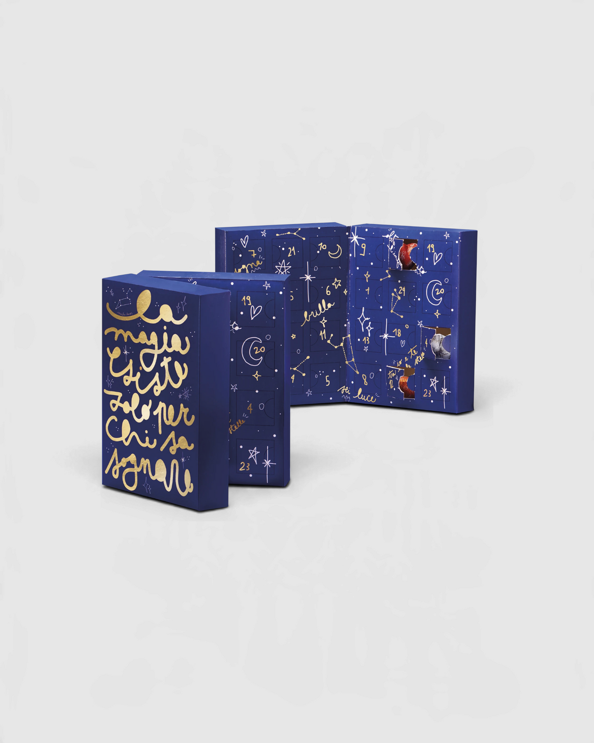 Calendario dell’Avvento Streglio con praline assortite, confezione blu e oro aperta e chiusa
